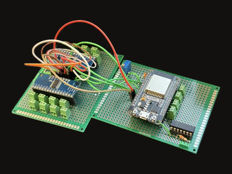 The hand-soldered circuit boards: an ESP32 and multiplexers on perfboard
