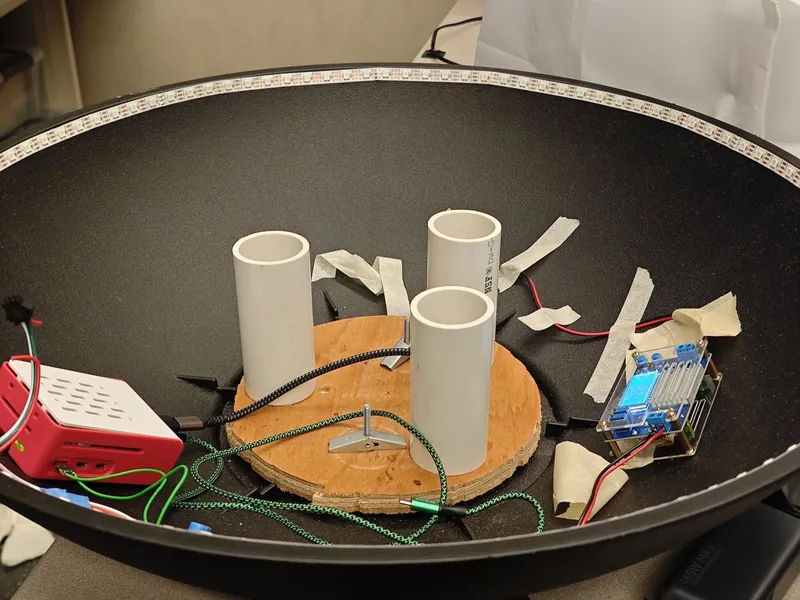 Inside SoundMat: the board on its supports, the Raspberry Pi, the power converter and the LED strip around the rim